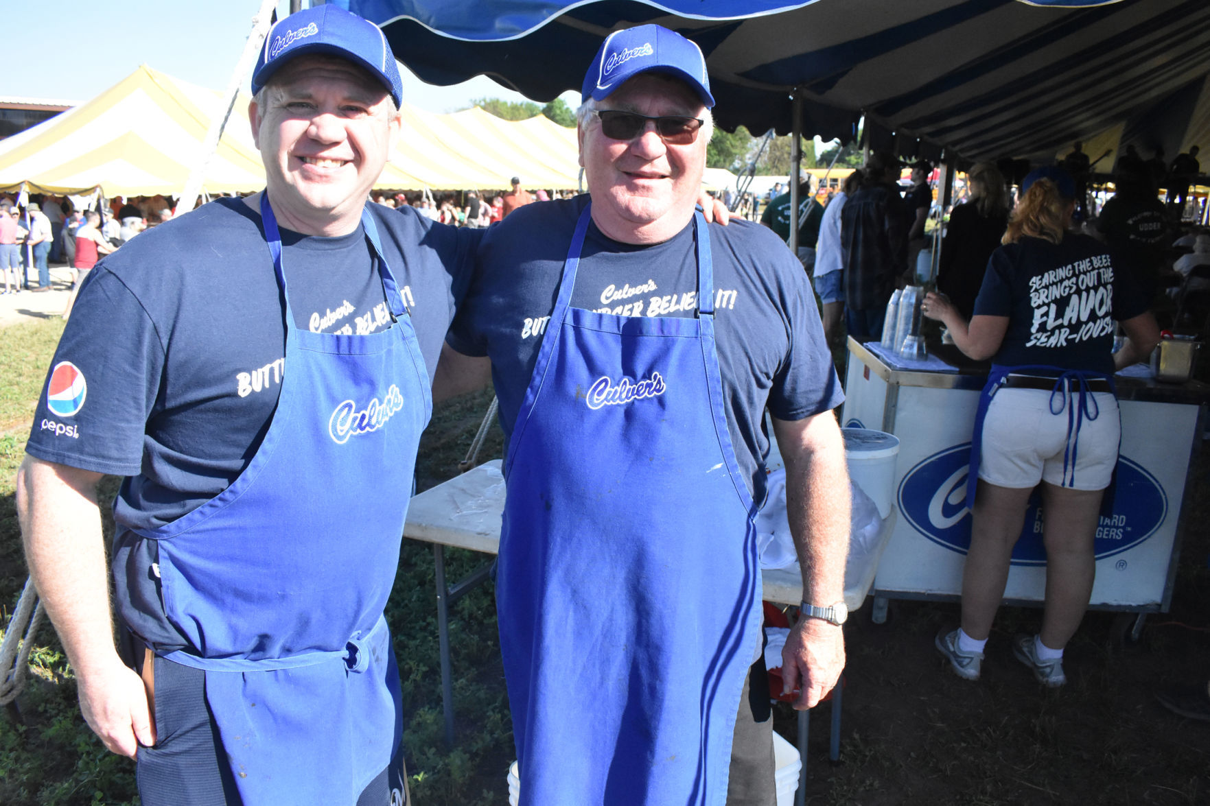 Father and son volunteer at dairy breakfast